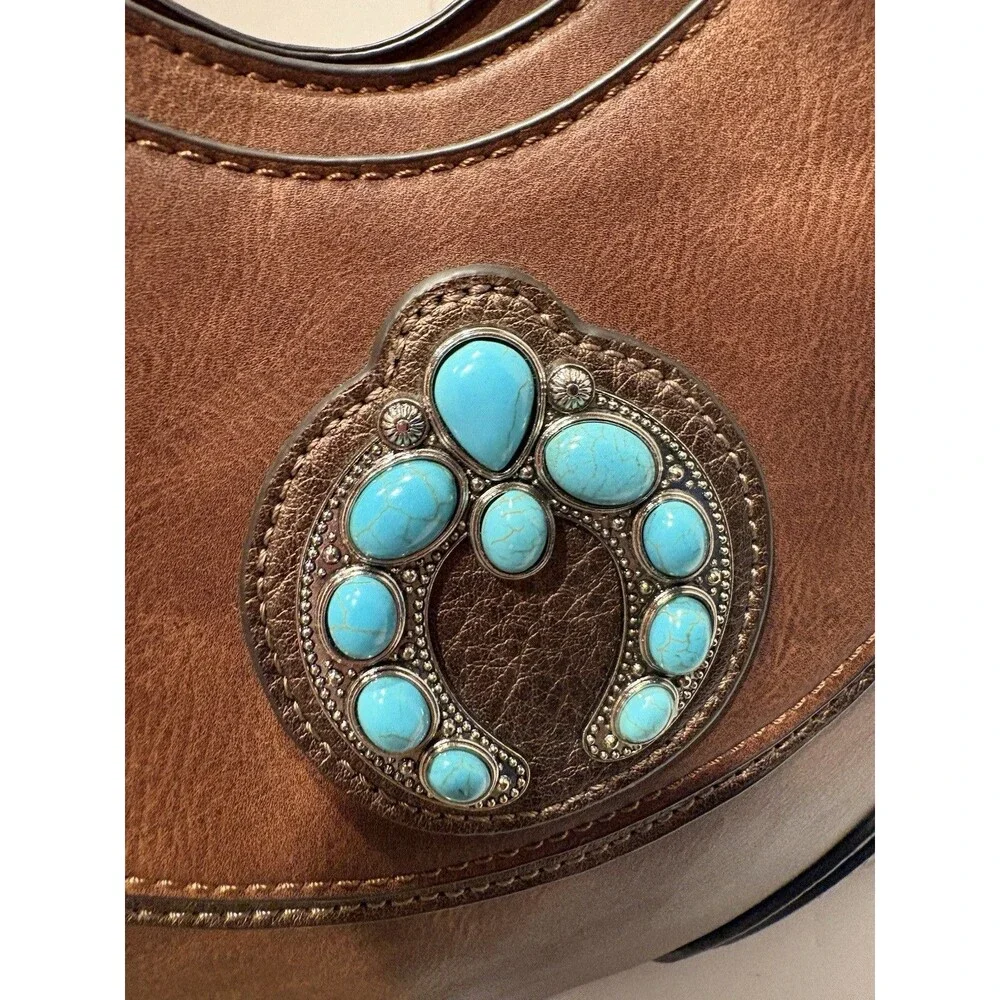 brown faux-leather Justin Naja Concho bag accented with a turquoise